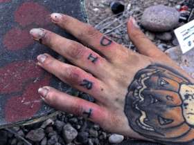 not that vanlife. close up of a dirty, tattooed hand