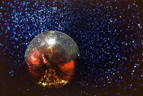 A disco ball and lights celebrating the end of diet culture